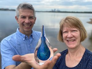 Naomi (Christensen) '81 and Steve Staruch with an Augsburg Water Droplet